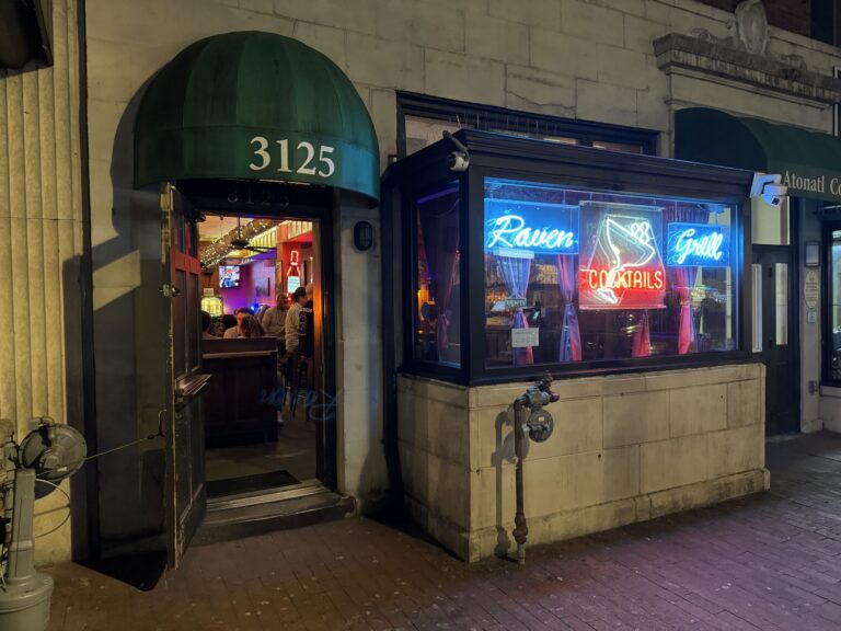 Raven Grill storefront on Mount Pleasant Street NW with the vintage neon Cocktails sign in the window