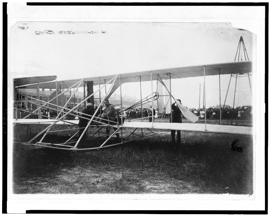 Lt. Thomas Selfridge and Orville Wright climbing into the Wright Flyer just before takeoff at Fort Myer, September 17, 1908
