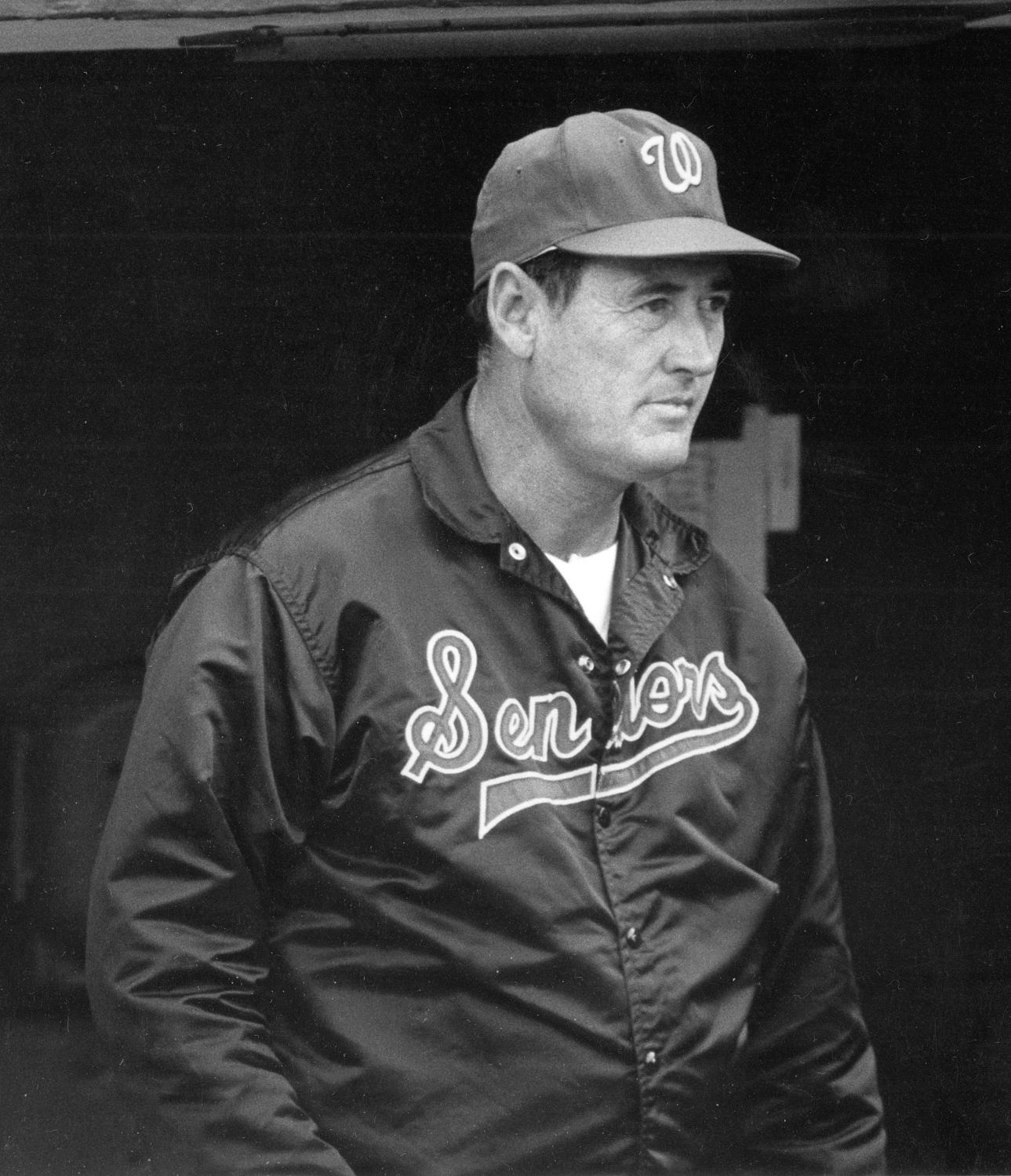 Ted Williams in a Washington Senators jacket and W cap, photographed at the dugout in 1969