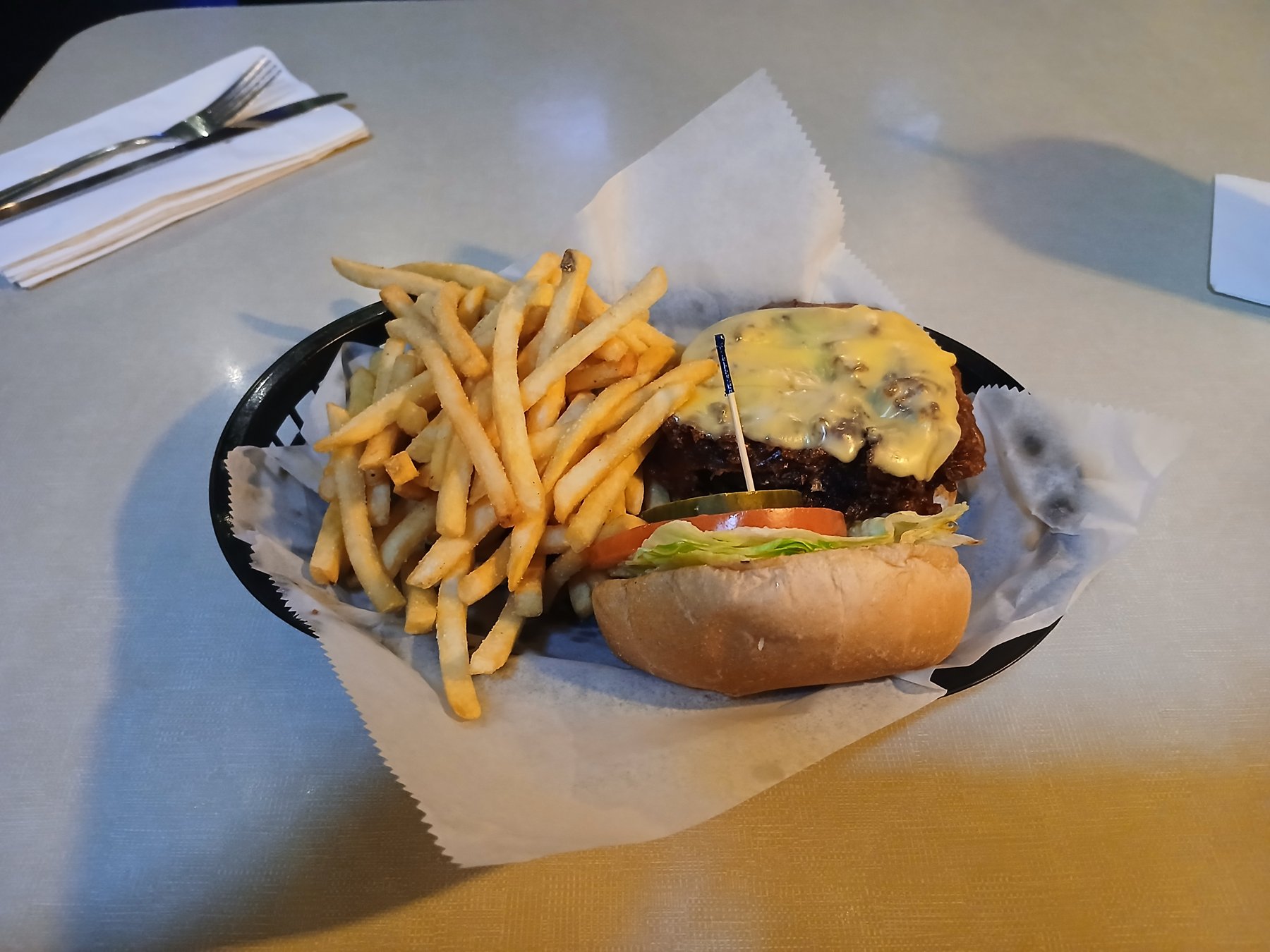 Plate of the Tune Inn's deep-fried burger with fries