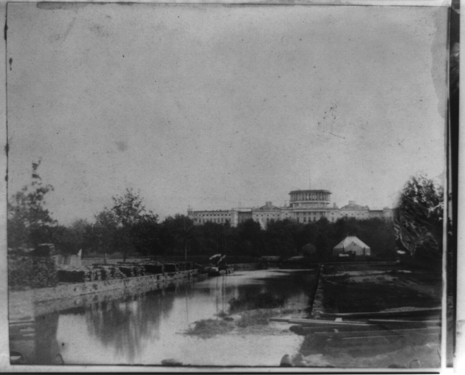 The open Washington Canal (Tiber Creek), 1859, looking east toward the Botanical Garden and the U.S. Capitol, the channel that bordered Murder Bay.