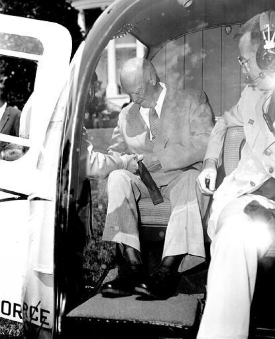 President Eisenhower fastens his seat belt aboard Bell H-13J Sioux 57-2729 on the White House South Lawn, July 12, 1957
