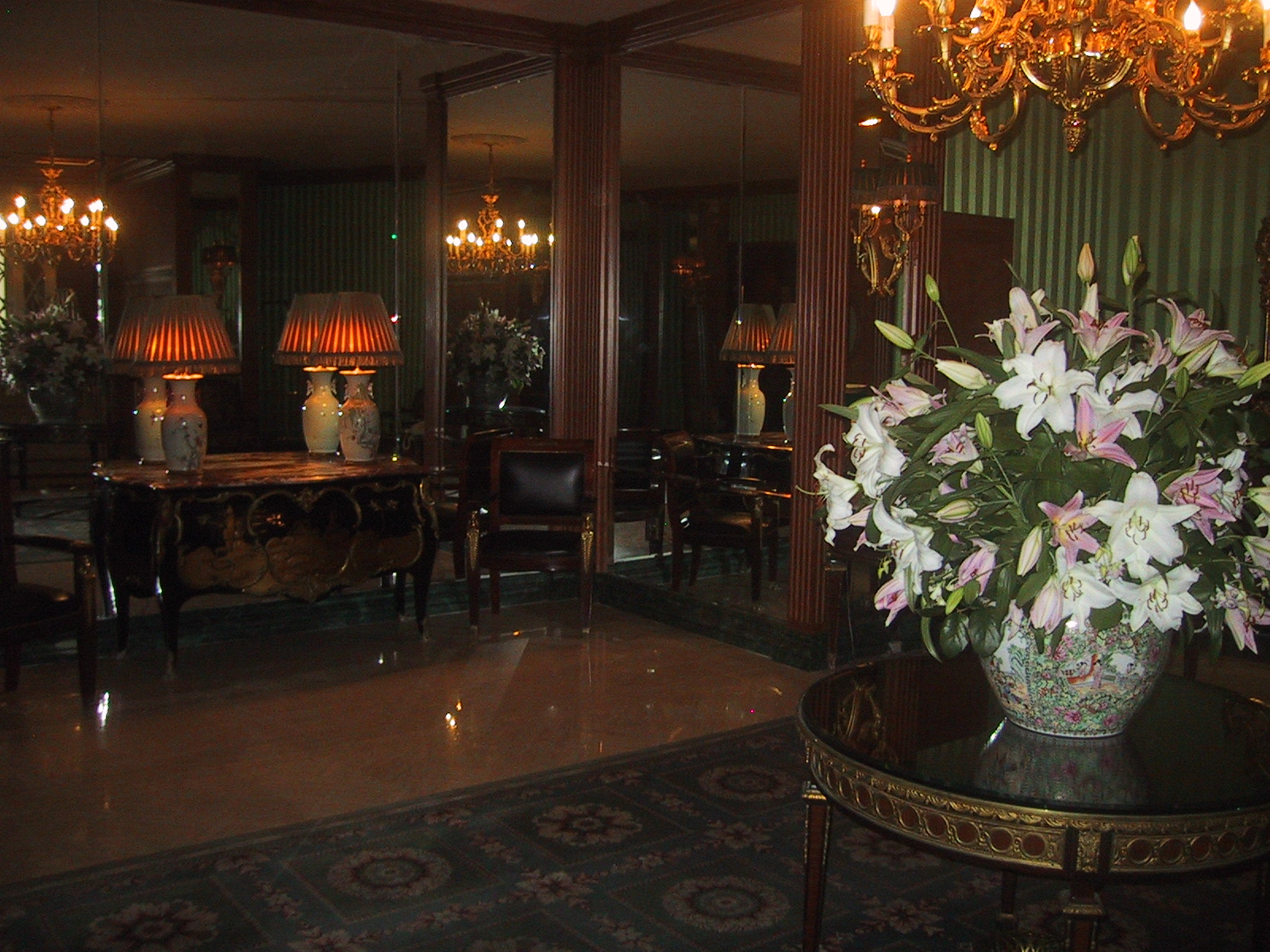 Hotel Lombardy lobby with chinoiserie porcelain vases, gilt chandeliers, mirrored walls, and Persian rug in 2006