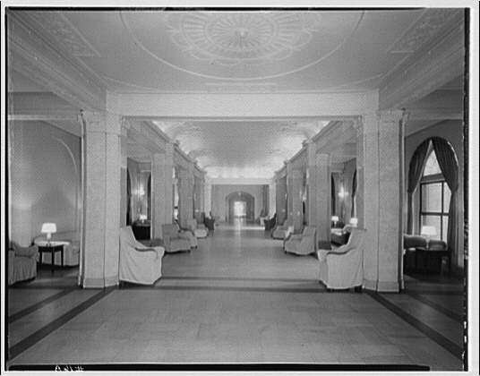 The marble-columned lobby at Meridian Mansions