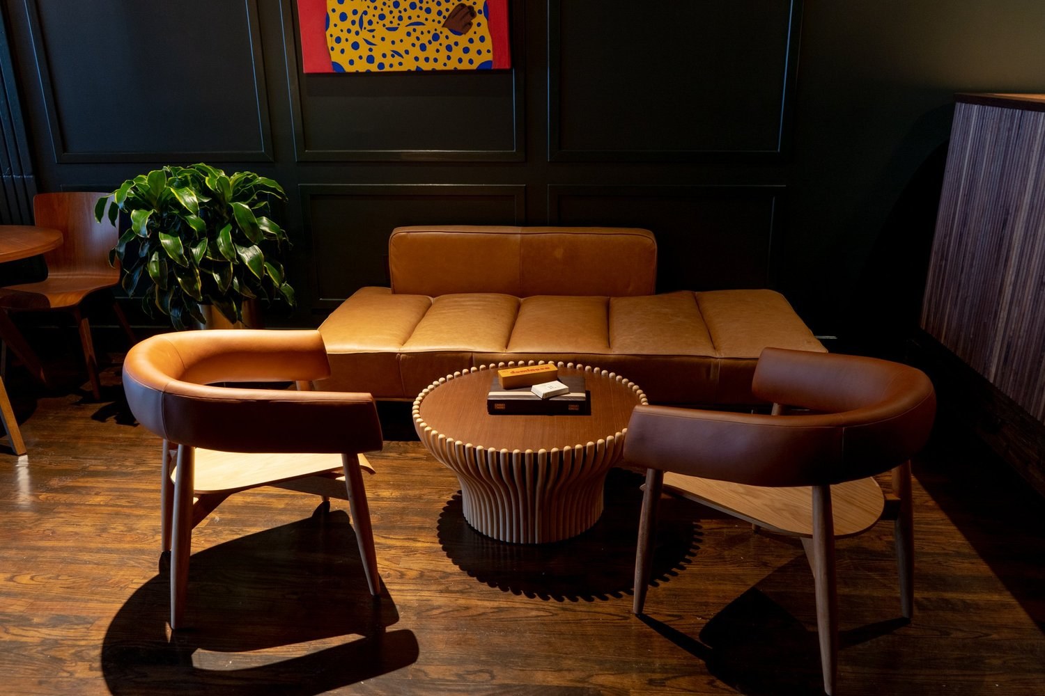 Shanklin Hall lounge at 2325 18th Street NW with leather seating and local artwork