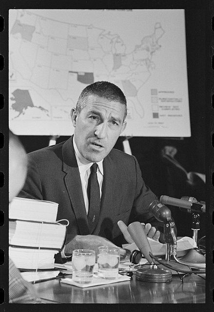 Interior Secretary Stewart Udall speaking at a press conference