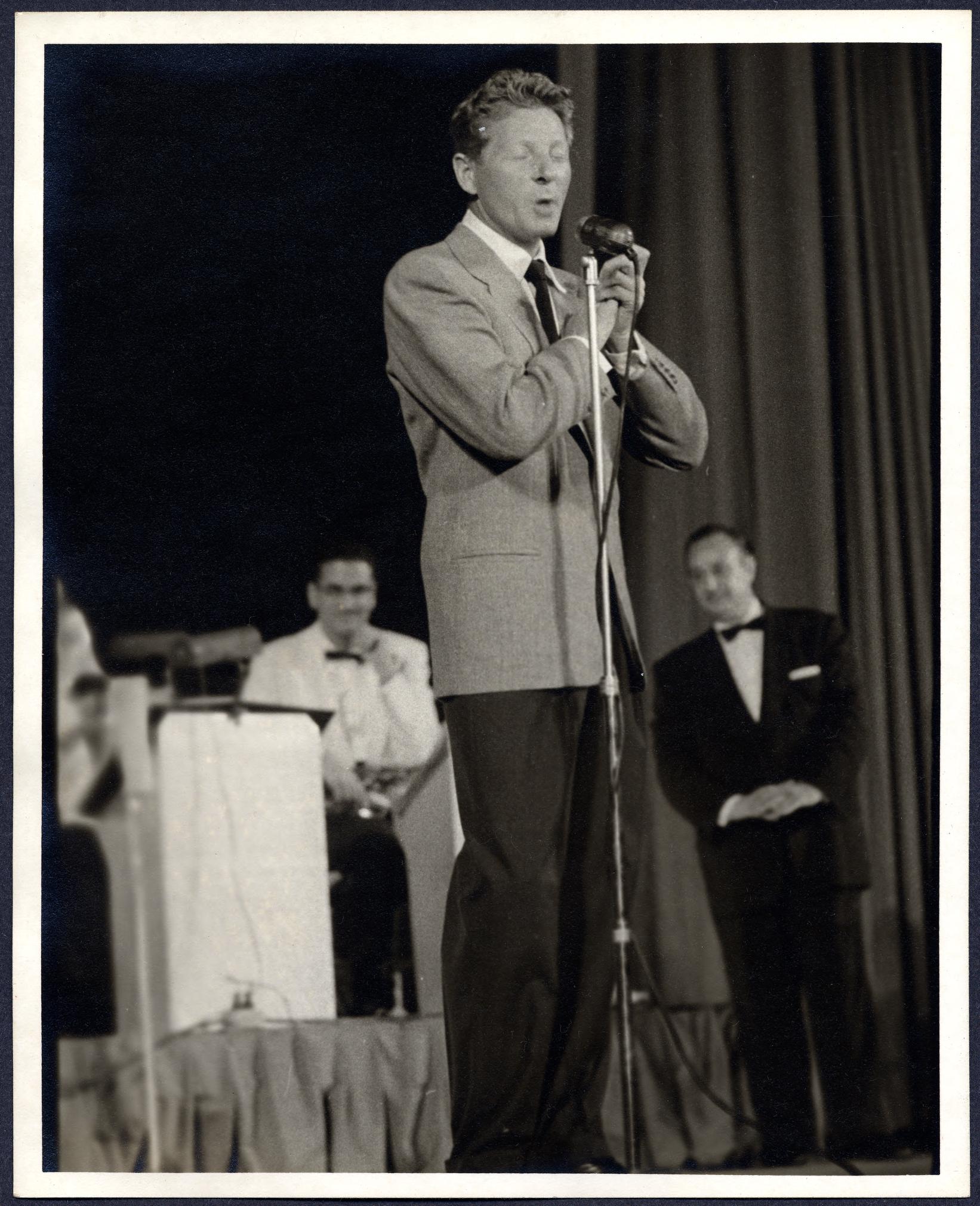 Danny Kaye at the microphone on the Carter Barron Amphitheater stage, 1956