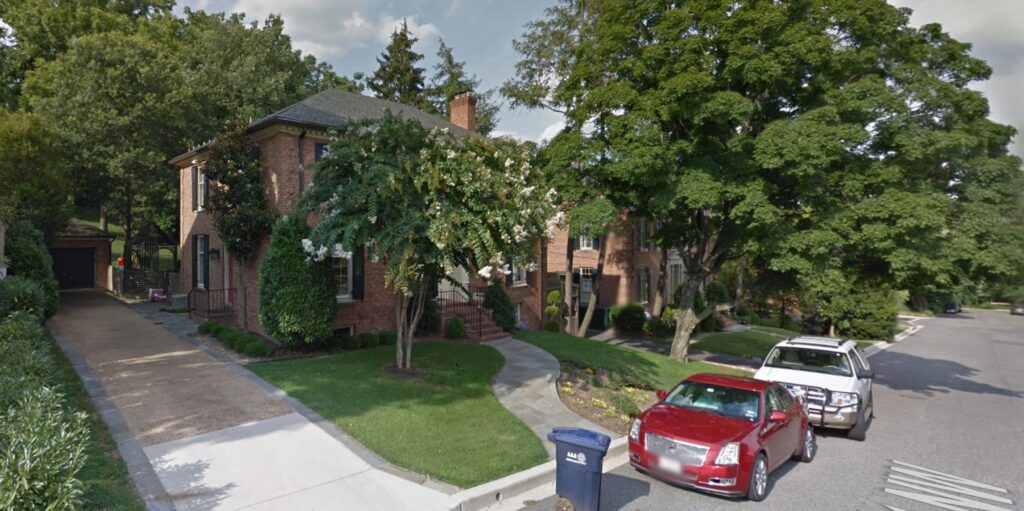 4407 W Street NW in July 2014, a two-story red brick house with dark shutters and a detached garage off Foxhall Road