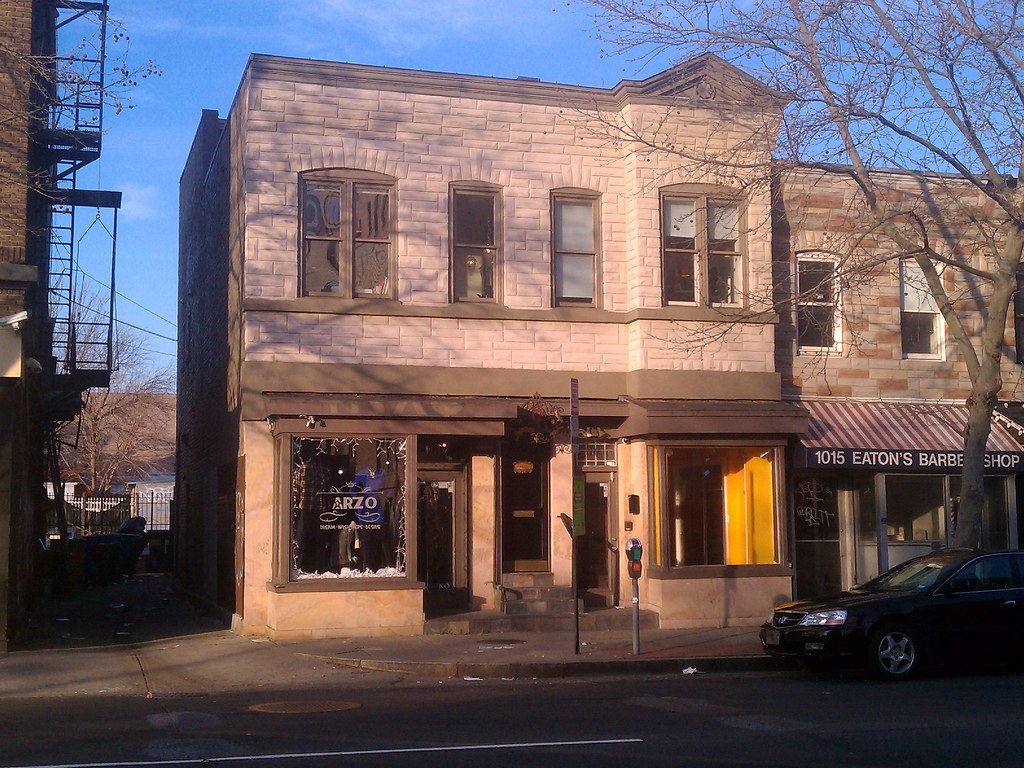 1019 U Street NW and neighboring storefronts, photographed from across the street.