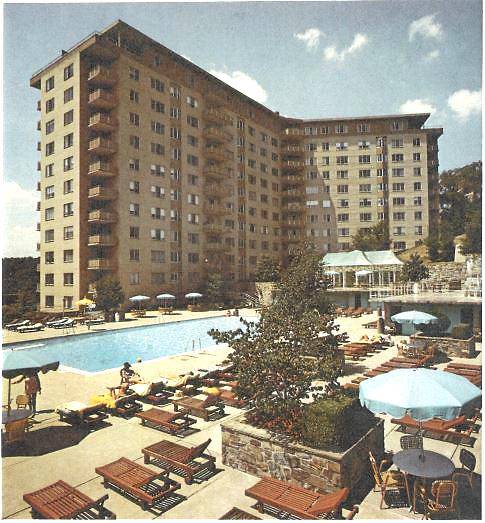 Scanned 1974 brochure image of The Colonnade's bilevel pool terrace, with the pergola on the upper tier and cabanas lining the lower pool deck.