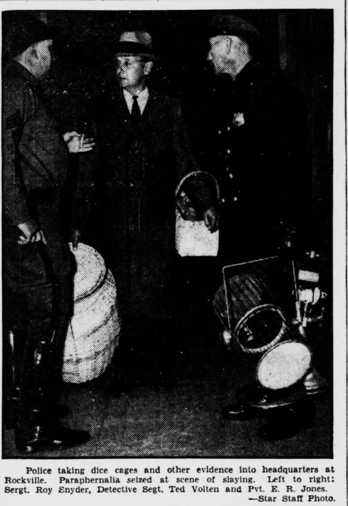 Evening Star staff photo, 1935: Montgomery County police carry dice cages and gambling equipment into Rockville headquarters