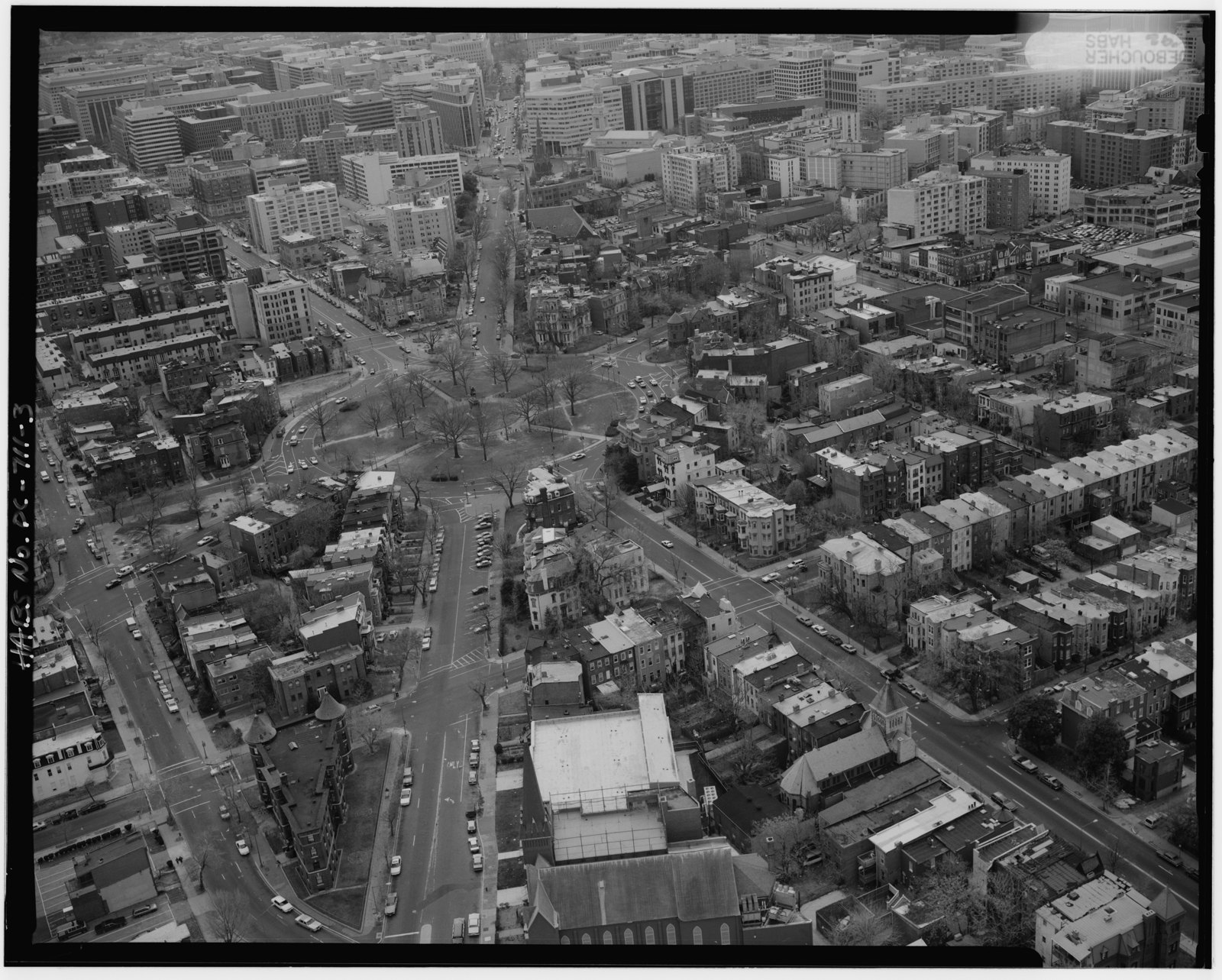 Aerial photograph of Vermont Avenue NW looking southwest toward Logan Circle, with rowhouse blocks on both sides
