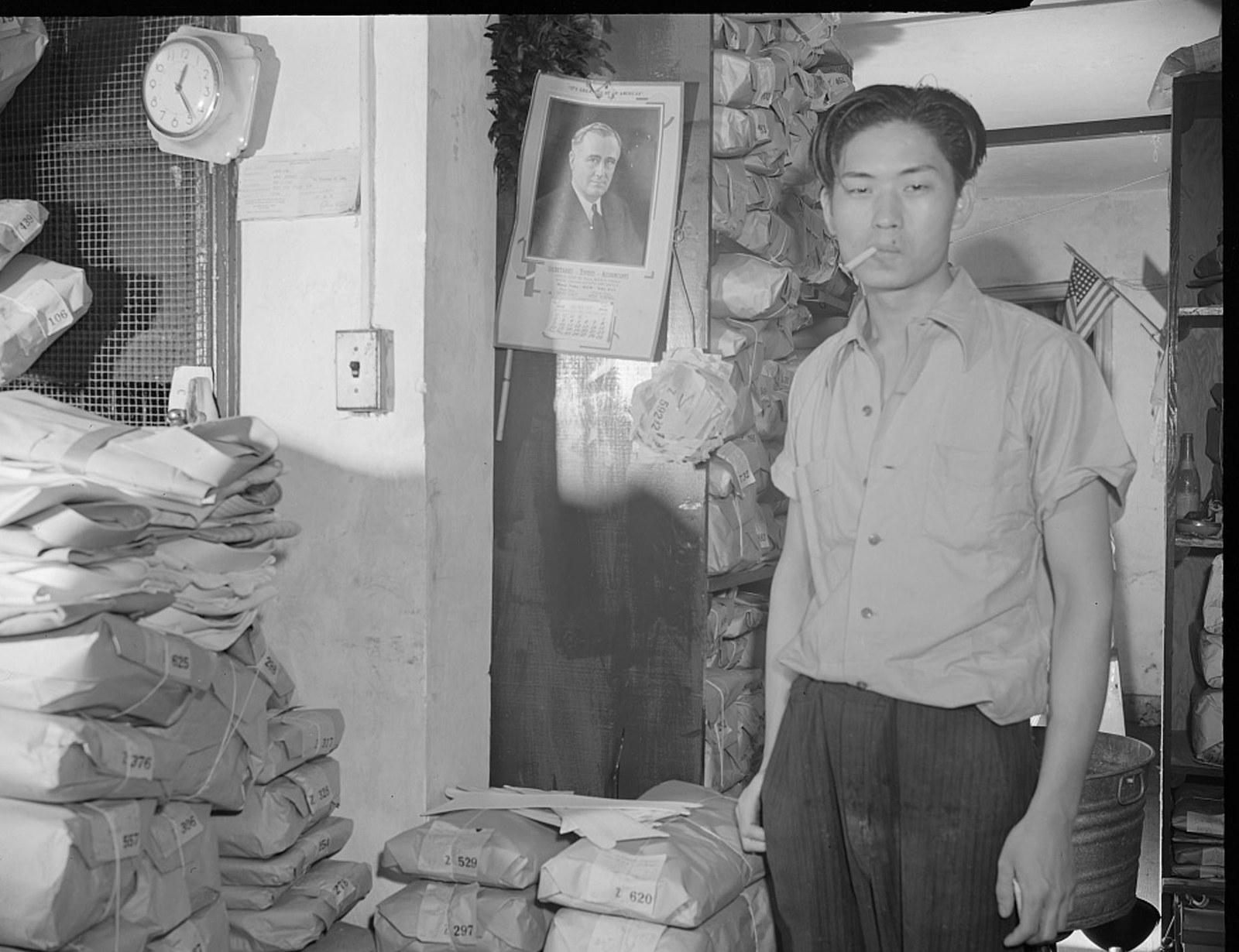 Johnnie Lew in the laundry below Ella Watson's apartment, 1942
