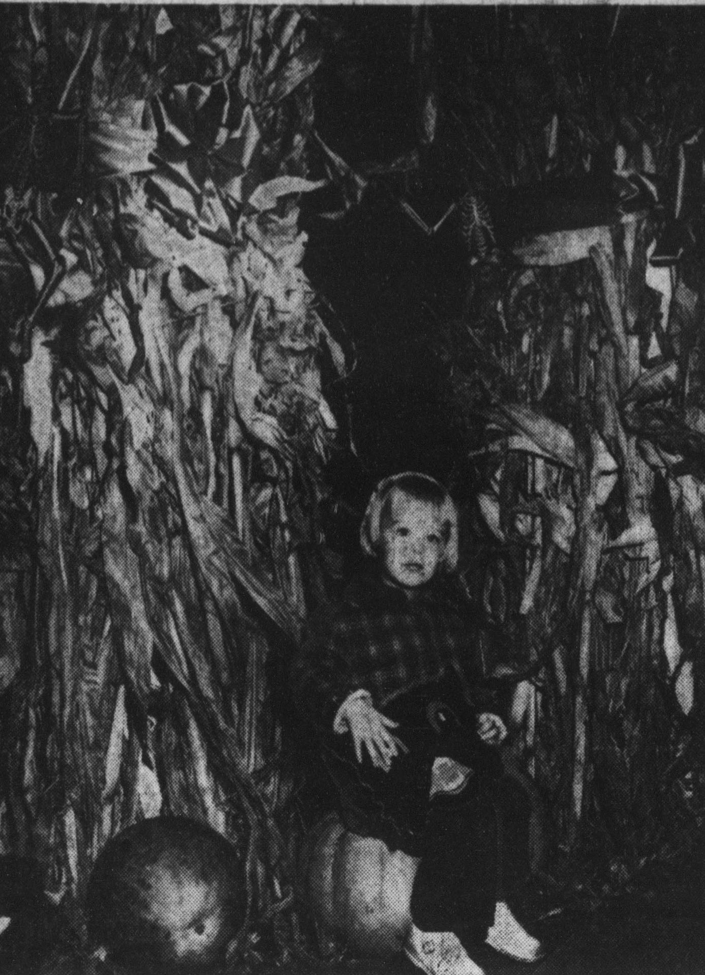 Mary Jean Eisenhower on a pumpkin in the White House lobby, 1958