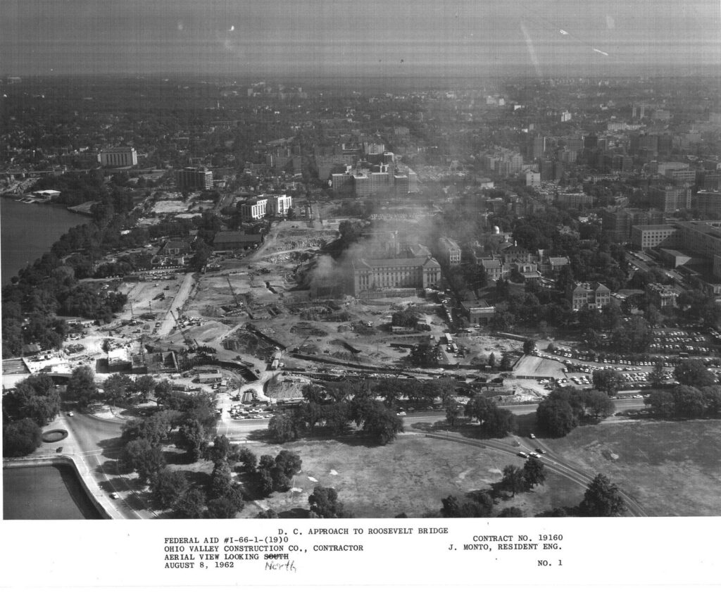 Aerial view looking north over Foggy Bottom on August 8, 1962, showing land cleared for the D.C. approach to the Theodore Roosevelt Bridge, labeled Federal Aid I-66