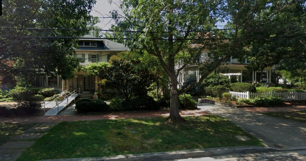 3314 Newark Street NW in Cleveland Park in July 2025, a stucco house with a hipped roof and dormer