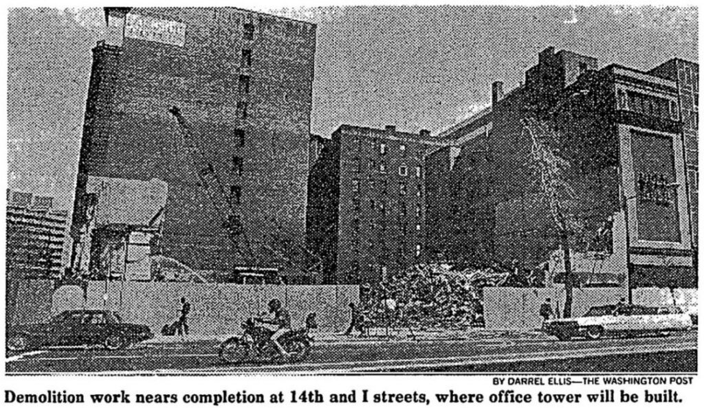 Rubble and partly demolished buildings behind a construction fence at 14th and I streets NW in 1986