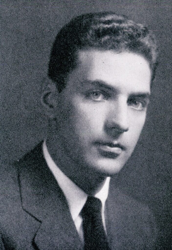 Yearbook portrait of a young William Peter Blatty in a suit and tie