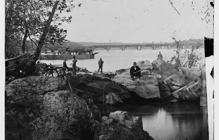 Washington, D.C. Georgetown ferry-boat carrying wagons, and Aqueduct Bridge beyond, from rocks on Mason's Island (Library of Congress)