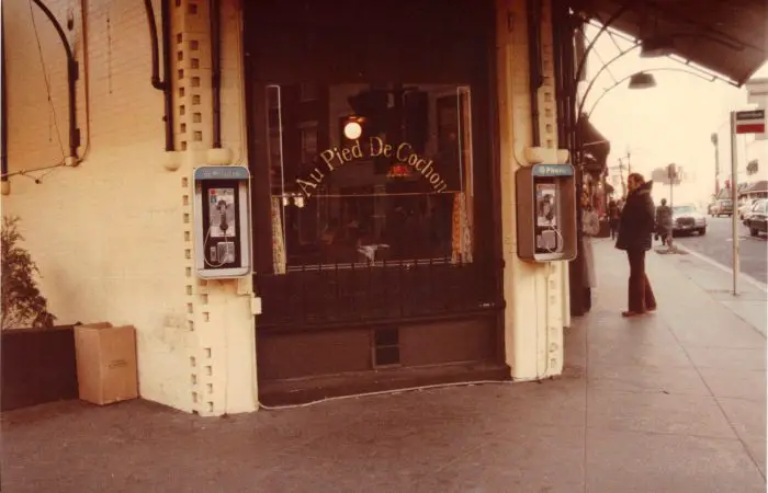 Au Pied De Cochon in 1980 with two payphones