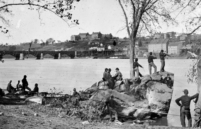 Union soldiers guarding the Potomac River in Washington, DC in 1861. Georgetown University is visible in the background. Photo by George Barnard